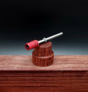 This image portrays Dynavap Spinning Mouthpiece-Redheart Wood by Dovetail Woodwork.