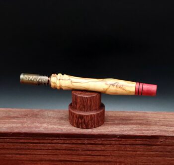 This image portrays Dynavap Spinning Mouthpiece-Redheart Wood by Dovetail Woodwork.