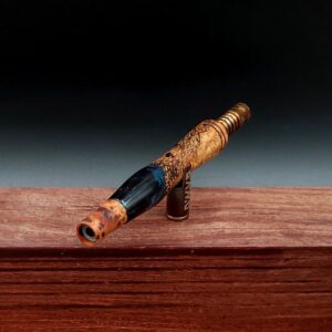 This image portrays Dynavap Spinning Mouthpiece-Thuya Burl by Dovetail Woodwork.