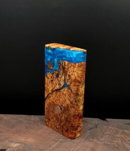 This image portrays Dynavap River Burl-2-G-Stash by Dovetail Woodwork.