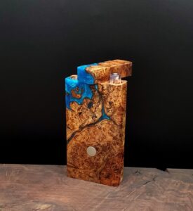 This image portrays Dynavap River Burl-2-G-Stash by Dovetail Woodwork.