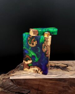 This image portrays Luminescent-2G-Stash-Cosmic Burl Hybrid-Dynavap Case by Dovetail Woodwork.