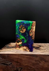 This image portrays Luminescent-2G-Stash-Cosmic Burl Hybrid-Dynavap Case by Dovetail Woodwork.