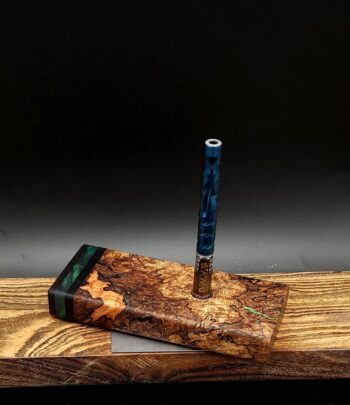 This image portrays Luminescent Cosmic Burl-Dynavap Stash Case by Dovetail Woodwork.