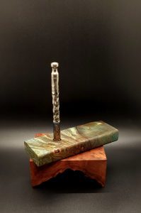 This image portrays Cosmic Burl-Live Edge-XL Dynavap Stash Case by Dovetail Woodwork.