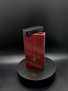 This image portrays 2G-XL Stash-Purpleheart/Ebony Wood-Dynavap Case by Dovetail Woodwork.