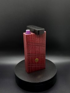 This image portrays 2G-XL Stash-Purpleheart/Ebony Wood-Dynavap Case by Dovetail Woodwork.