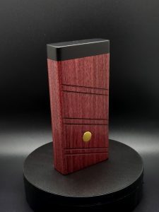 This image portrays 2G-XL Stash-Purpleheart/Ebony Wood-Dynavap Case by Dovetail Woodwork.
