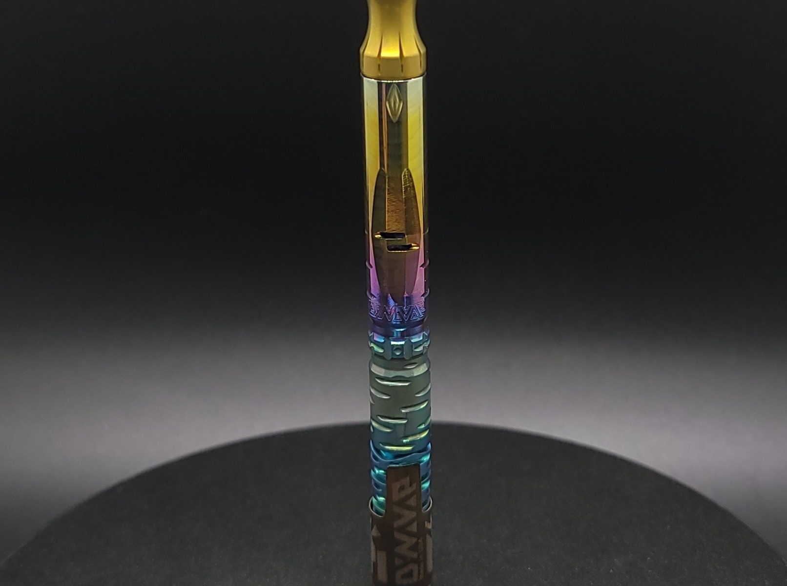 This image portrays Green to Gold Anodized Titanium Dynavap Omni(2021)-Full Stem by Dovetail Woodwork.