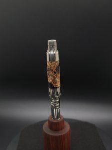 This image portrays Vong(i) Custom Sleeve-Black Walnut Burl Hybrid by Dovetail Woodwork.