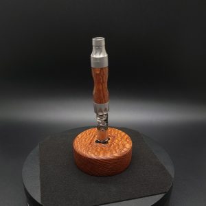 This image portrays DynaPuck-Single Dynavap Stem Display-Leopard Wood by Dovetail Woodwork.