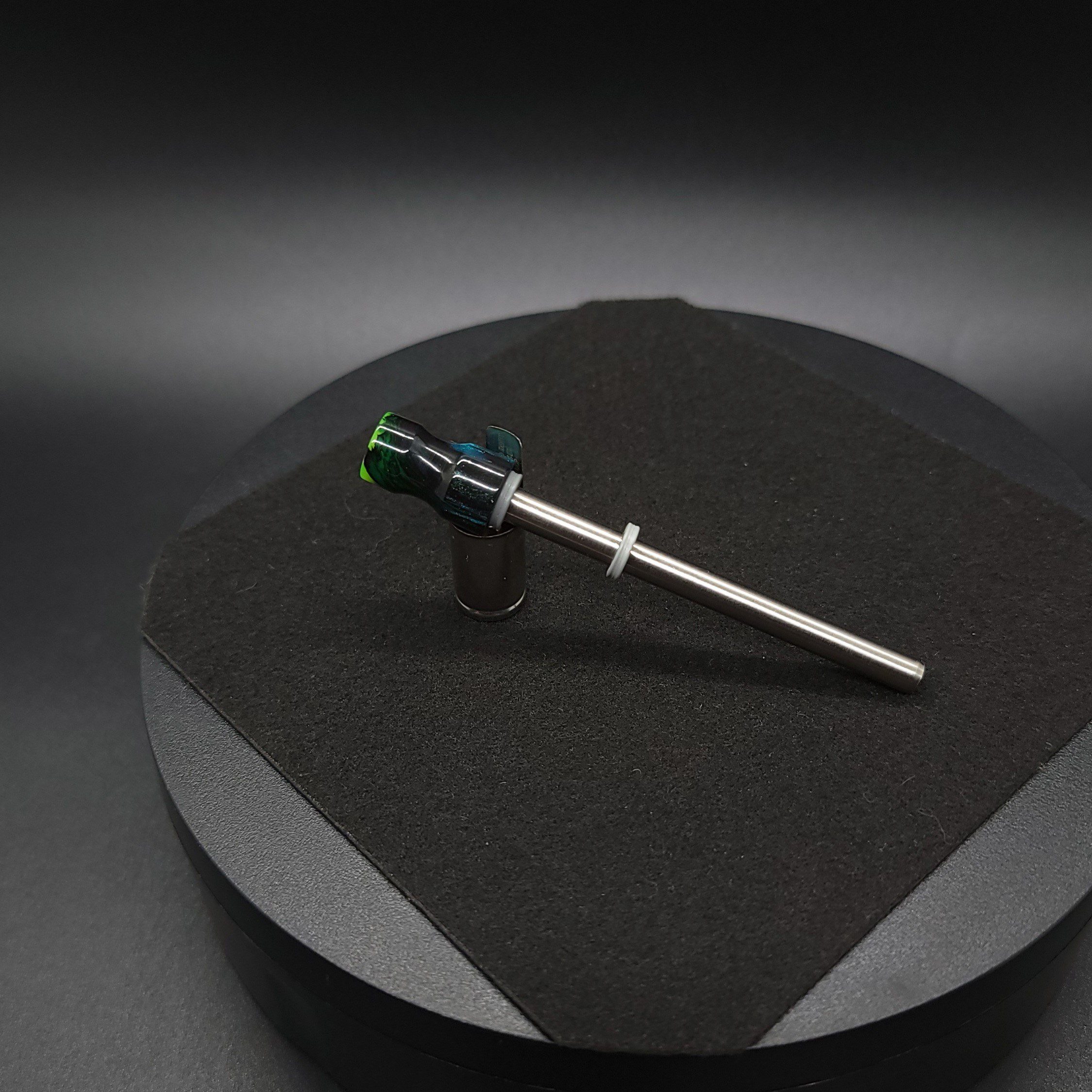 This image portrays Dynavap Spinning Mouthpiece-Galactic Resin/Luminescent by Dovetail Woodwork.