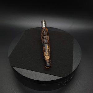 This image portrays Twisted Stems Series-Skeleton Dynavap Stem with Mouthpiece & XL Condenser by Dovetail Woodwork.
