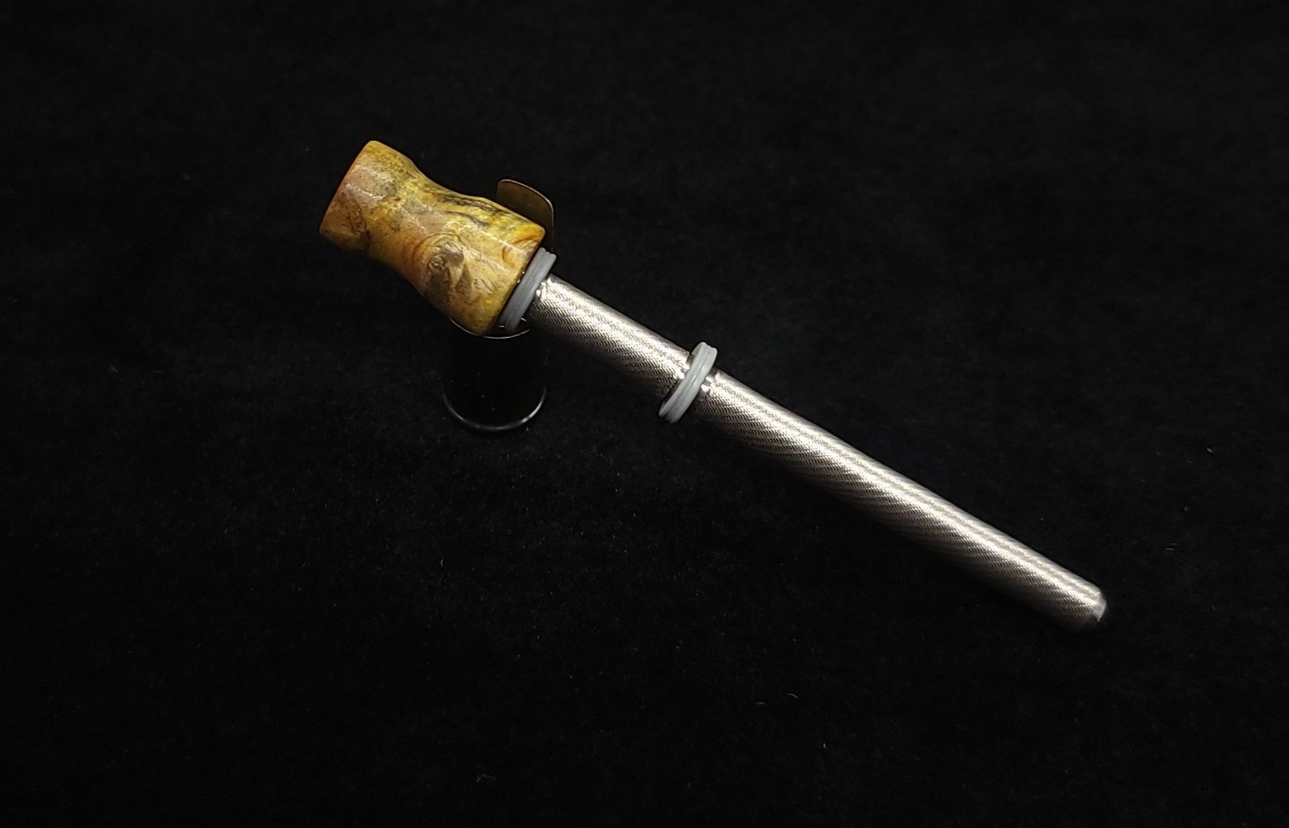 This image portrays Dynavap Spinning Mouthpiece-Golden/Green/Black Cosmic Burl by Dovetail Woodwork.