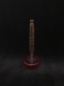 This image portrays High Class-Knurled XL Dynavap Stem/Claro Walnut Burl with Matching Mouthpiece by Dovetail Woodwork.