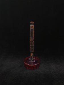 This image portrays High Class-Knurled XL Dynavap Stem/Claro Walnut Burl with Matching Mouthpiece by Dovetail Woodwork.