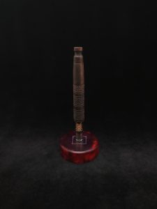 This image portrays High Class-Knurled XL Dynavap Stem/Claro Walnut Burl with Matching Mouthpiece by Dovetail Woodwork.