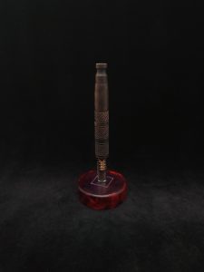 This image portrays High Class-Knurled XL Dynavap Stem/Claro Walnut Burl with Matching Mouthpiece by Dovetail Woodwork.