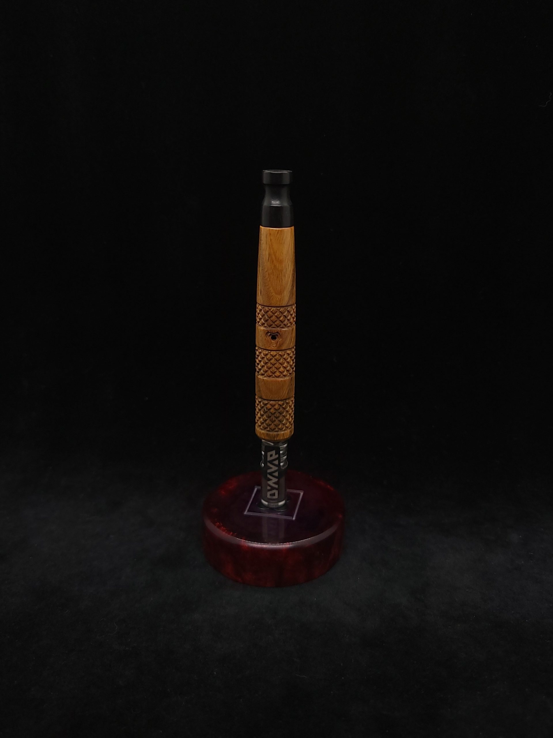 This image portrays High Class-Knurled XL Dynavap Stem/Lignum Vitae with Ebony Mouthpiece by Dovetail Woodwork.