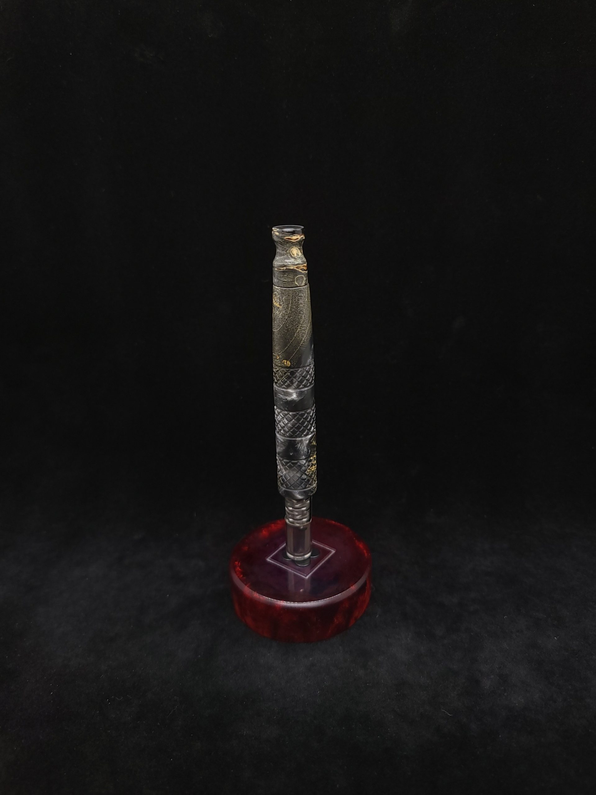 This image portrays High Class-Knurled XL Dynavap Stem/Gun Metal Burl Hybrid + Matching Mouthpiece by Dovetail Woodwork.