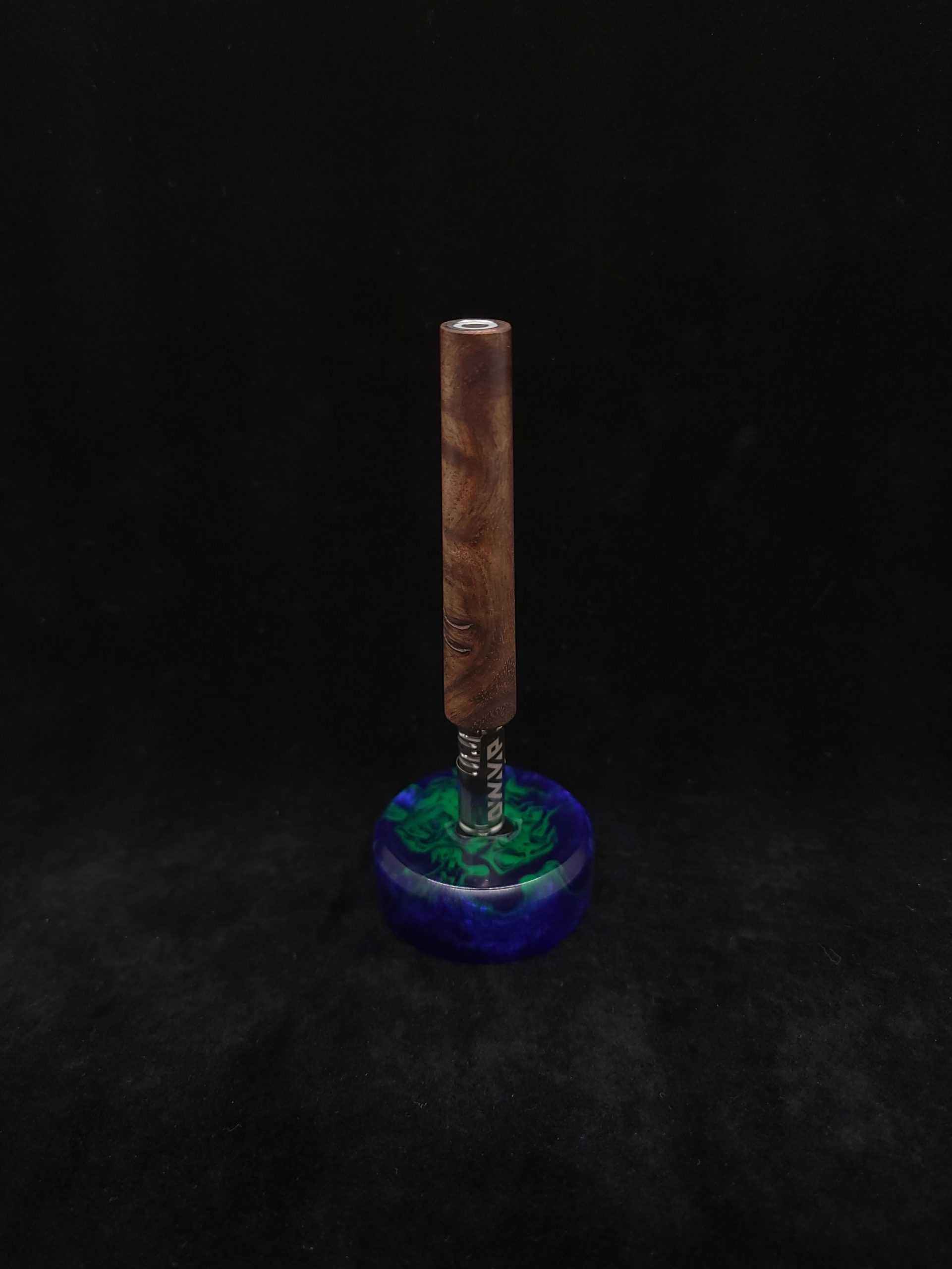 This image portrays The Blunt XL Dynavap Stem/Walnut Burl Wood by Dovetail Woodwork.