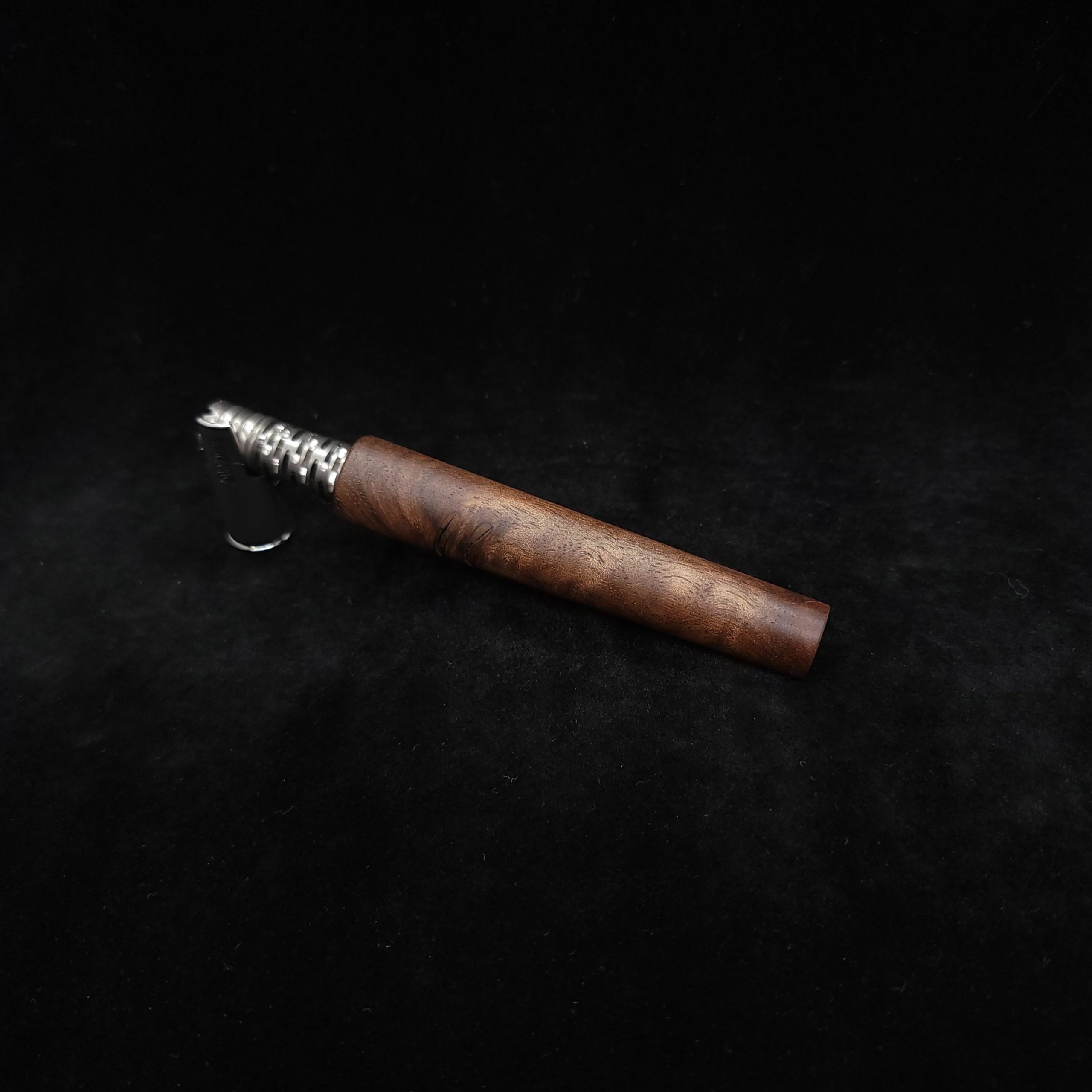 This image portrays The Blunt XL Dynavap Stem/Walnut Burl Wood by Dovetail Woodwork.