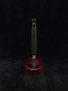 This image portrays Reaper XL Dynavap Stem/Matte Ebony Wood + Gloss Black Mouthpiece by Dovetail Woodwork.
