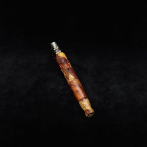 This image portrays Specialty Stem-Spider XL Dynavap Stem-High Grade Amboyna Burl Wood + M.P. by Dovetail Woodwork.