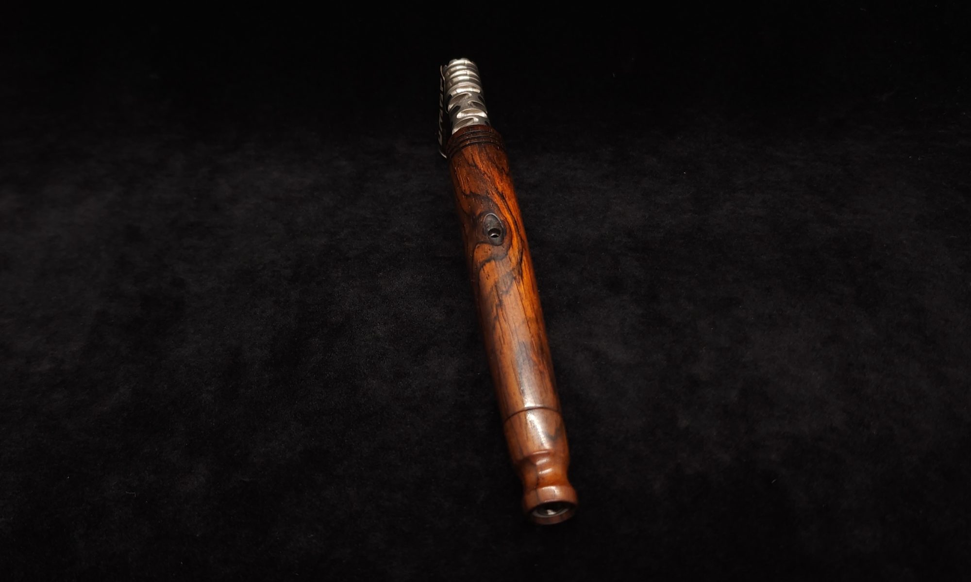 This image portrays Tapered Dynavap XL Cocobolo Stem + Matching Mouthpiece by Dovetail Woodwork.