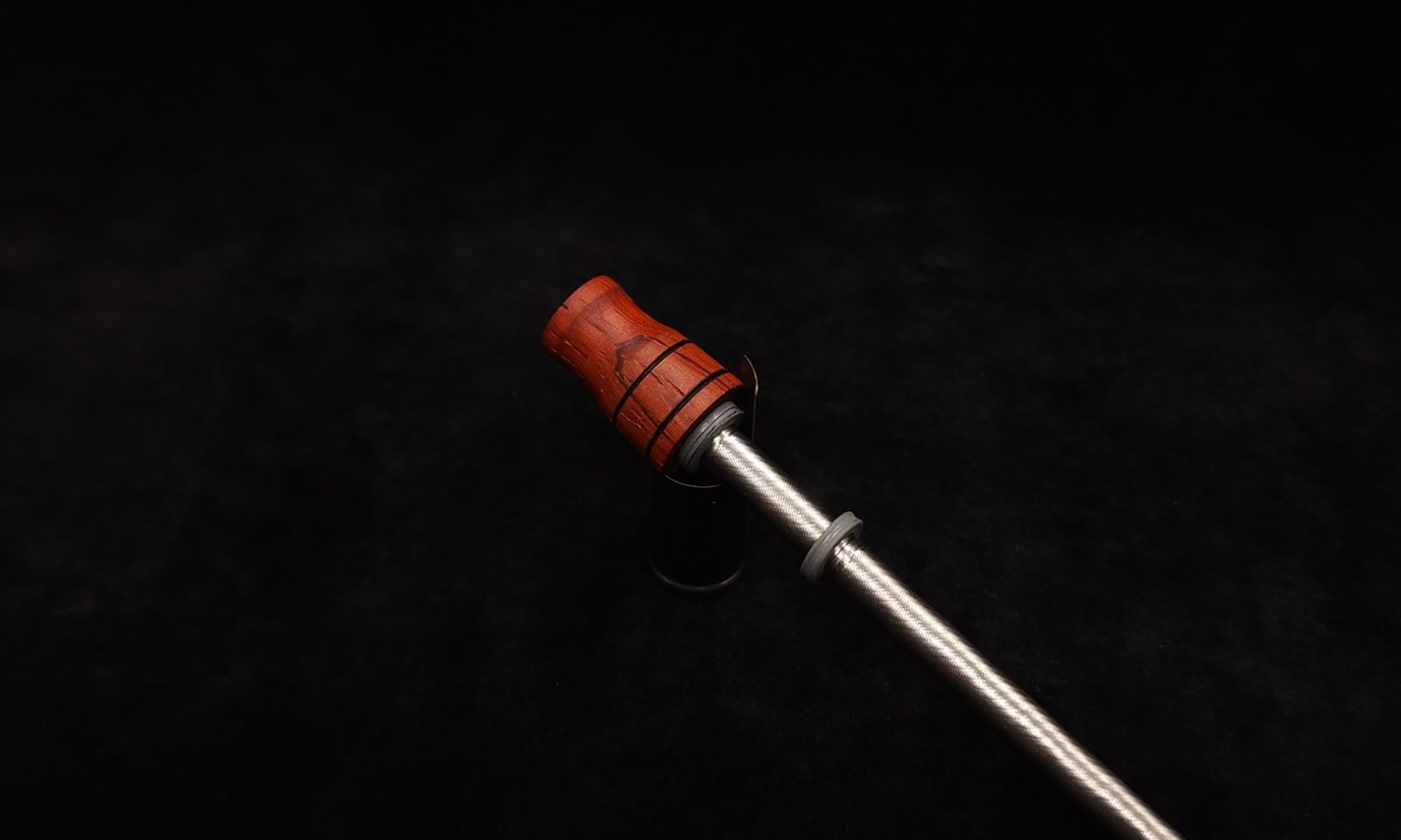 This image portrays Dynavap Spinning Mouthpiece-Specialty Bloodwood by Dovetail Woodwork.
