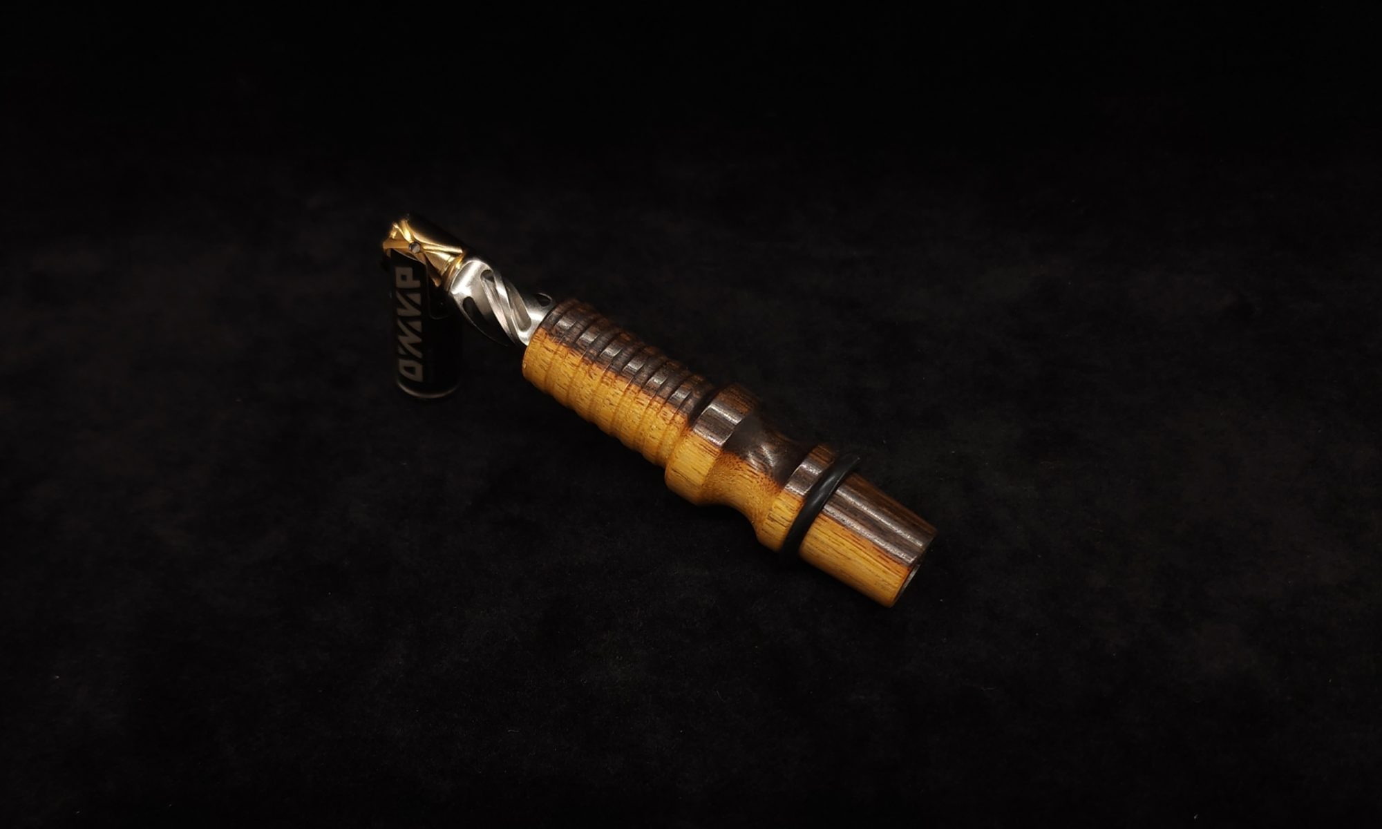 This image portrays Dynavap 14mm WPA Stem-S.S. Metal Core-Desert Ironwood-NEW! by Dovetail Woodwork.