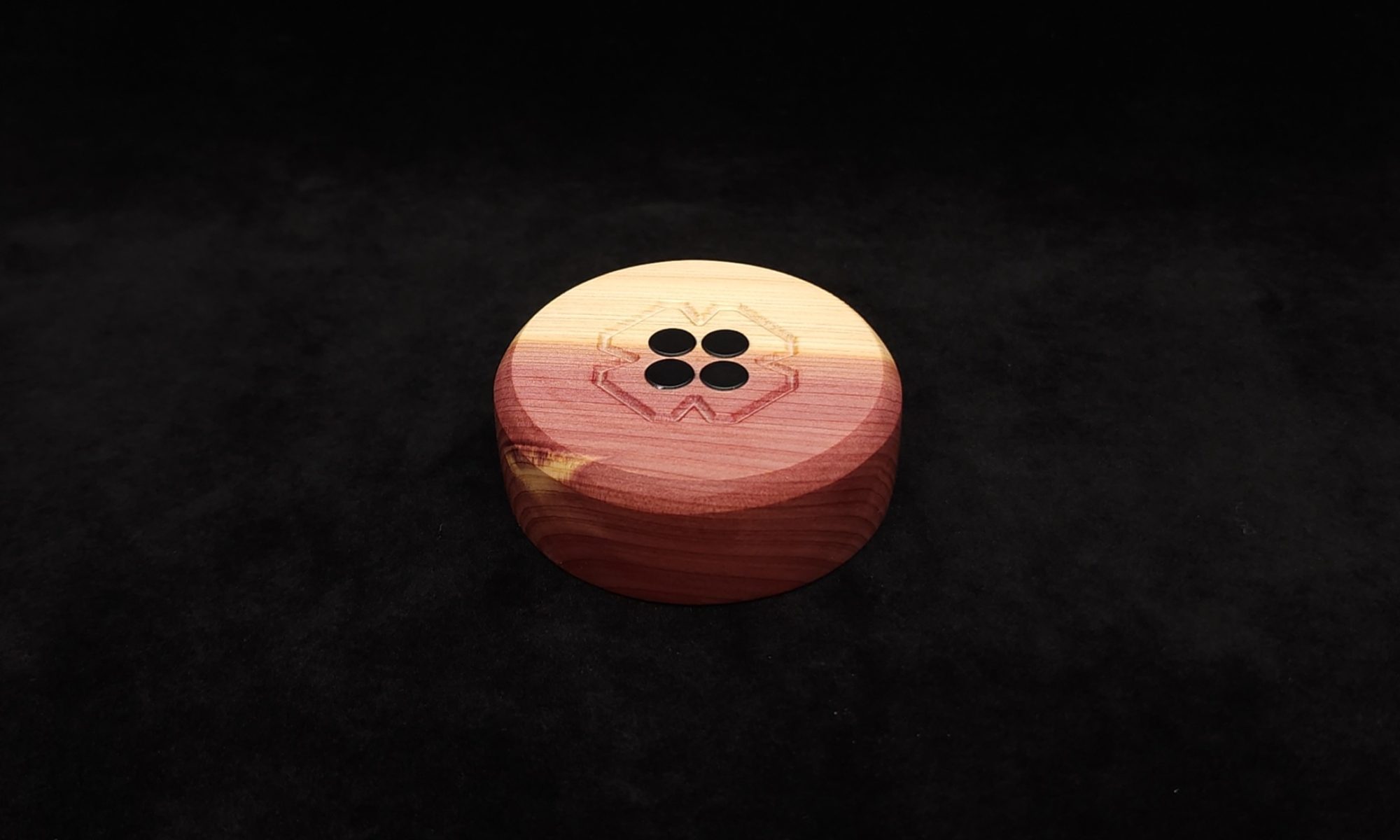 This image portrays DynaPuck-Aromatic Cedar Wood-Dynavap Stem Display by Dovetail Woodwork.