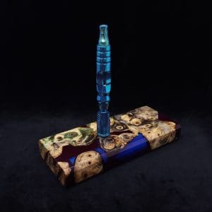 This image portrays Dynavap Device/Material Storage Case-Buckeye Burl Hybrid (XL) by Dovetail Woodwork.