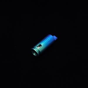 This image portrays The Dynavap Thermal Hyper Cap/Custom Anodized Green-Blue Fade by Dovetail Woodwork.