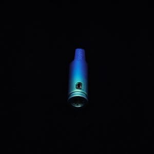 This image portrays The Dynavap Thermal Hyper Cap/Custom Anodized Green-Blue Fade by Dovetail Woodwork.