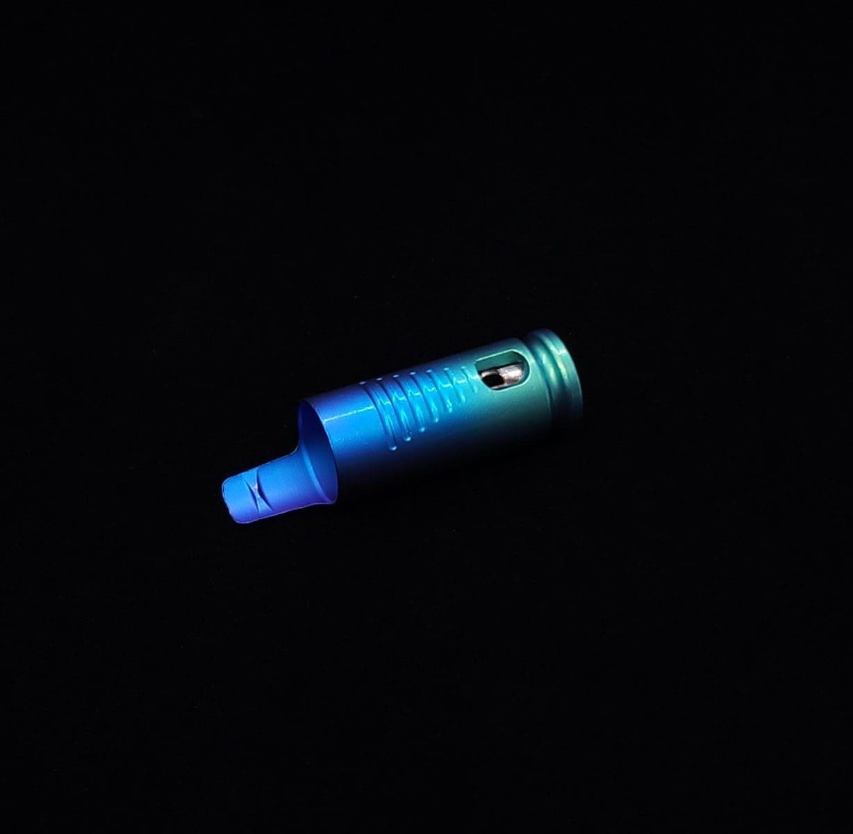 This image portrays The Dynavap Thermal Hyper Cap/Custom Anodized Green-Blue Fade by Dovetail Woodwork.