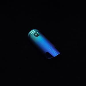 This image portrays The Dynavap Thermal Hyper Cap/Custom Anodized Green-Blue Fade by Dovetail Woodwork.
