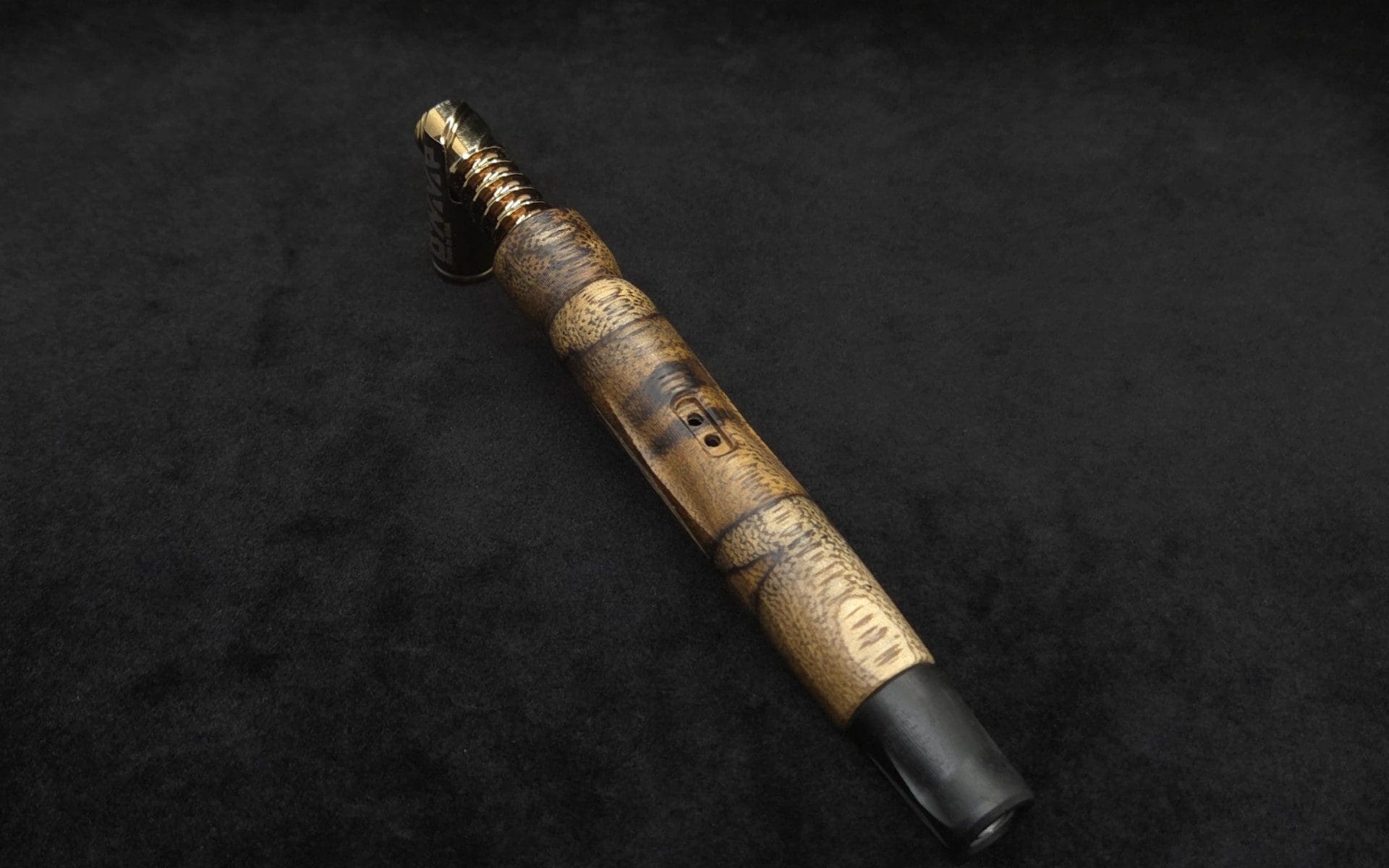 This image portrays Diamond Wing XL Dynavap Stem(Cross Grain Black Limba) + Matched Ebony M.P. by Dovetail Woodwork.